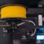 3D printer spool feeding into a 3D printer