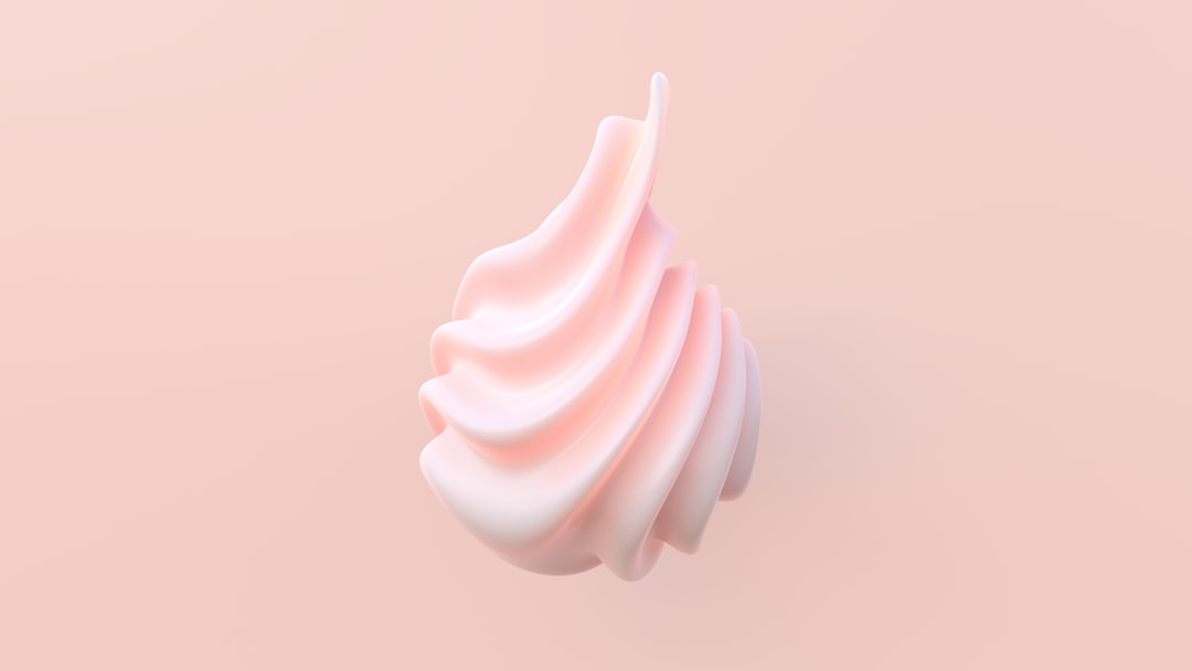 a close up of a pink object on a pink background
