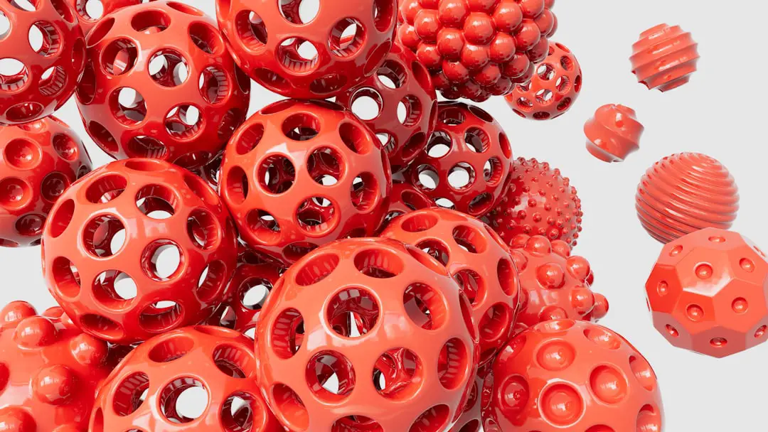 Glossy red spheres in space - Abstract by 3D Printed a pile of red plastic balls with holes on them
