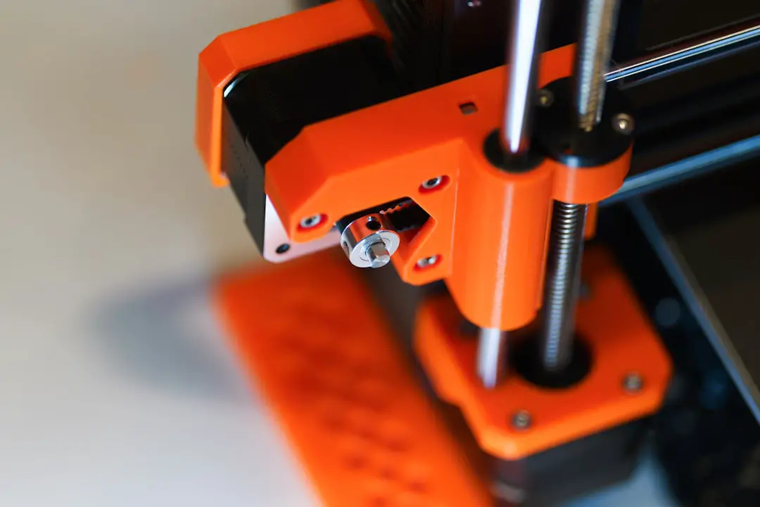 A close up of an orange and black machine