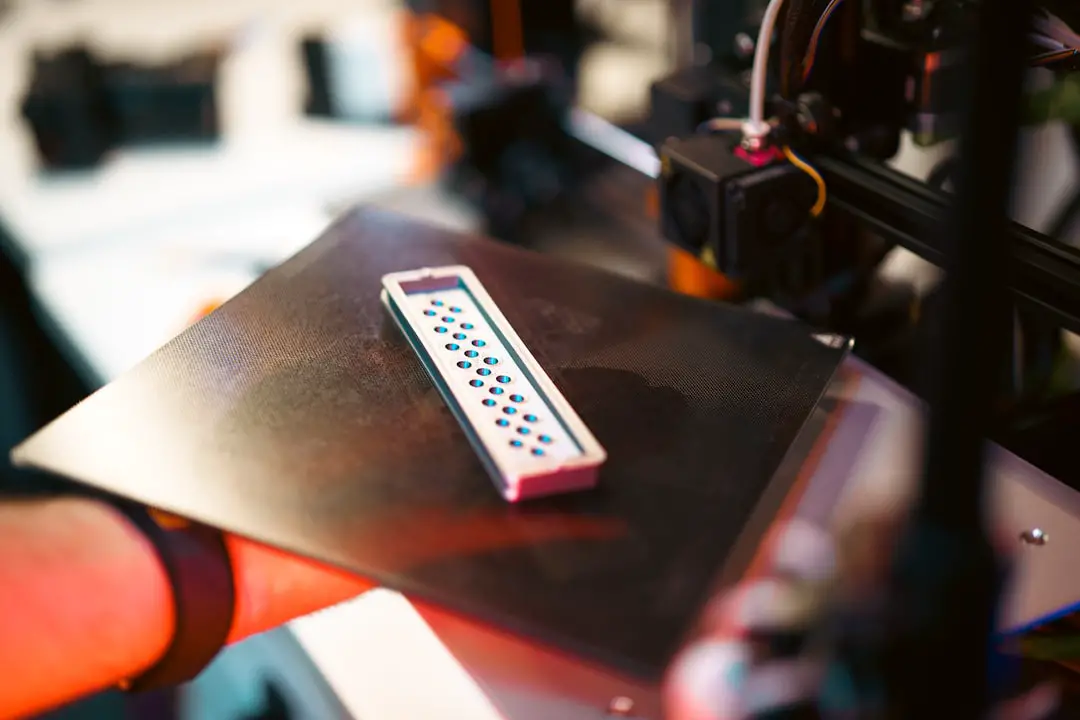 A 3d-printed object sits on the printer.