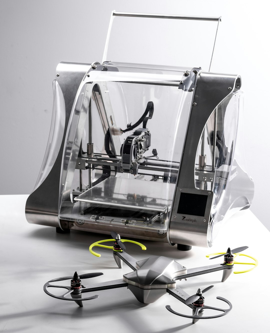 gray 3D printer by drone on tablee